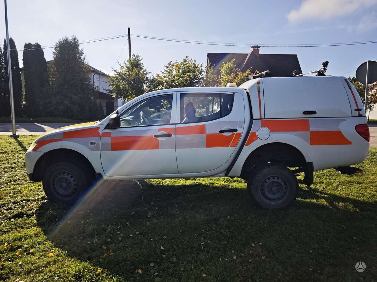 Mitsubishi L200 2010 — photo 7