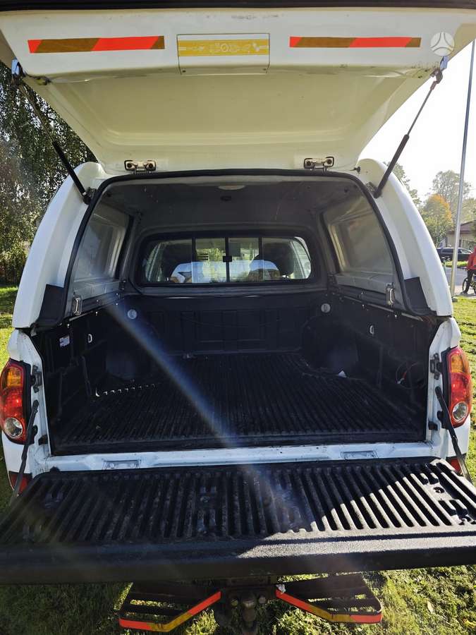Mitsubishi L200 2010 — photo 9