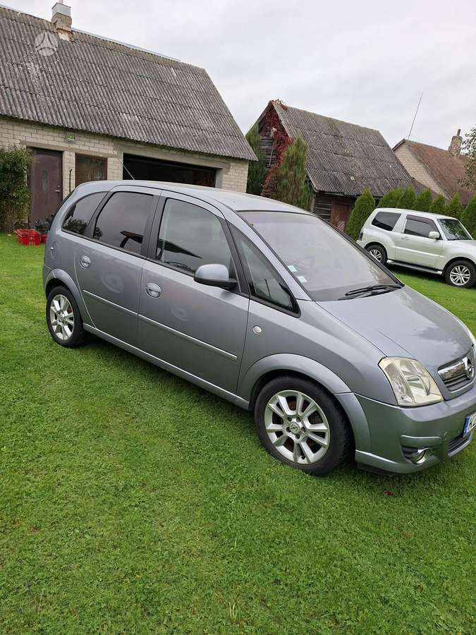 Opel Meriva 2009 — фото 13