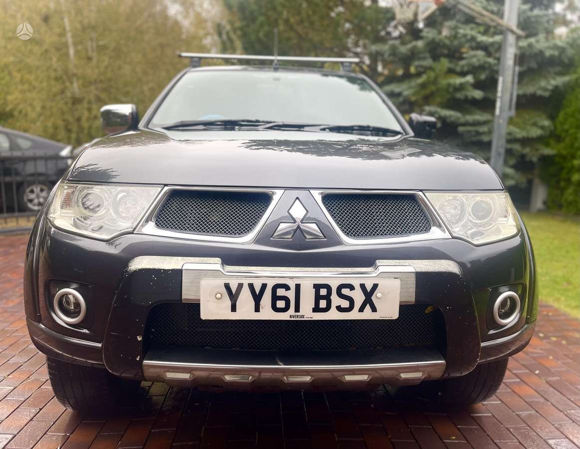 Mitsubishi L200 2011 — вигляд ззаду