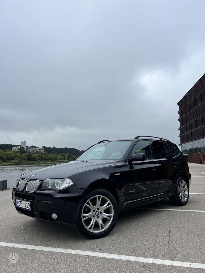BMW X3 2009 — rear view