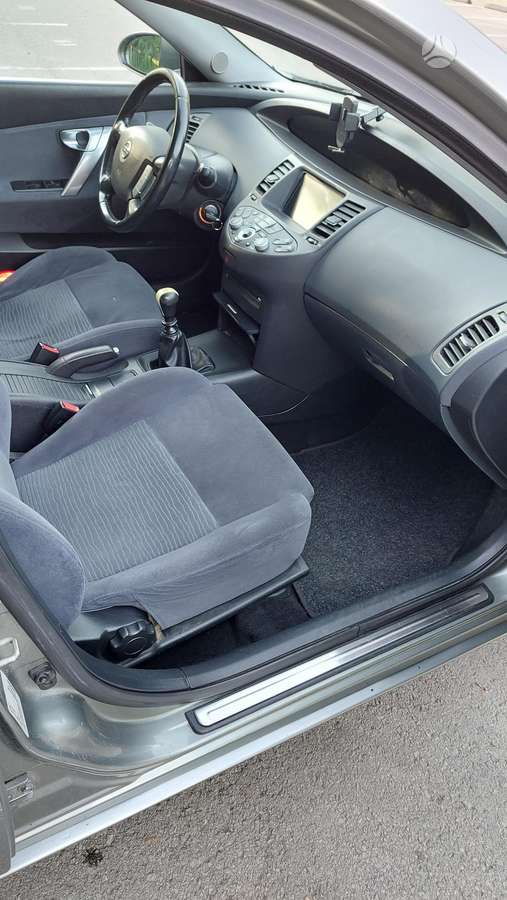 Nissan Primera 2004 — photo 11