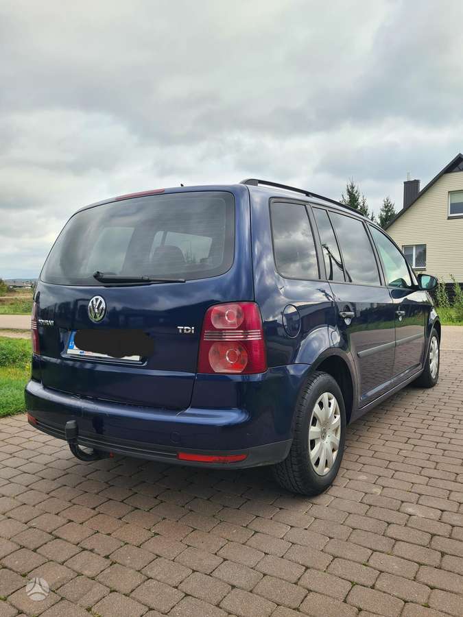 Volkswagen Touran 2009 — engine 1896 cm³, 105 HP (77kW)